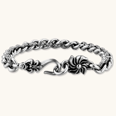 Oxidized 925 sterling silver twisted chain bracelet with engraved links, floral pinwheel charm, and S-hook clasp, 7.2mm wide.