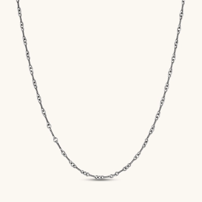 Oxidized 925 sterling silver necklace with alternating twisted rope and oval cable links, lobster clasp, on cream background.