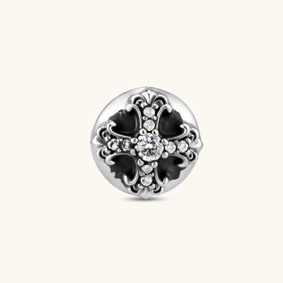 Sterling silver dome stud earring with oxidized black petals, ornate scrollwork, and clear cubic zirconia stones, butterfly back.