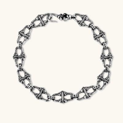 Sterling silver link bracelet with fleur-de-lis cross motifs, oxidized detailing, and hook clasp, 200mm length.