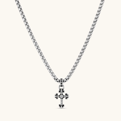 Sterling silver gothic cross pendant with ornate fleur-de-lis tips, pavé crystals, and center stone on a box chain.