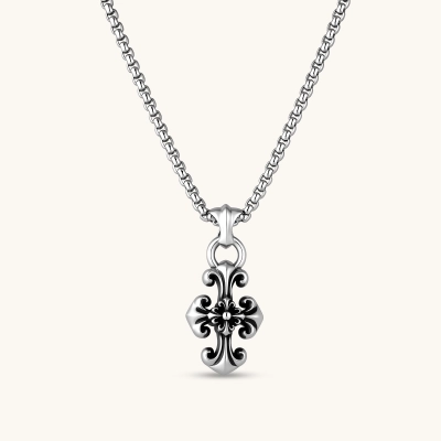Sterling silver baroque floral cross pendant on a box chain, with oxidized black scrollwork detailing, 45mm length.