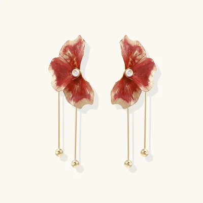 Pair of gold plated eco-brass flower earrings with red enamel petals, a round MOP bead center and long ball-tipped bars.