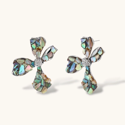 Pair of oversized four-petal flower stud earrings with iridescent teal and blush shell mosaic on silver-tone petals.