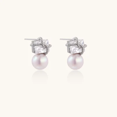 White gold stud earrings with square crystal stones in twisted frames and pink freshwater pearl drops below