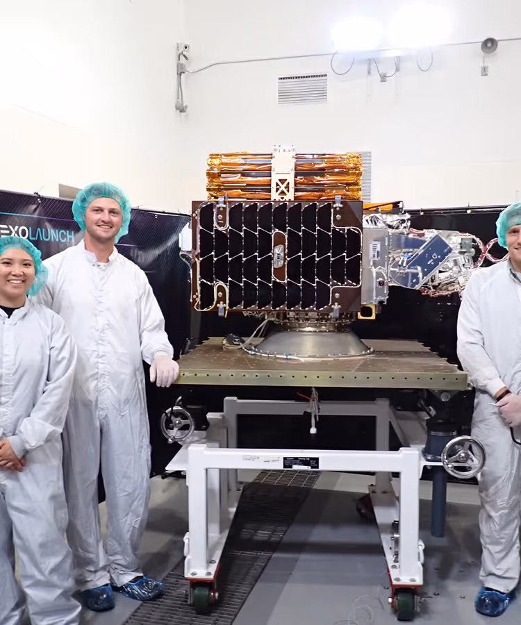 Capella team in front of stowed Acadia satellite ready for launch
