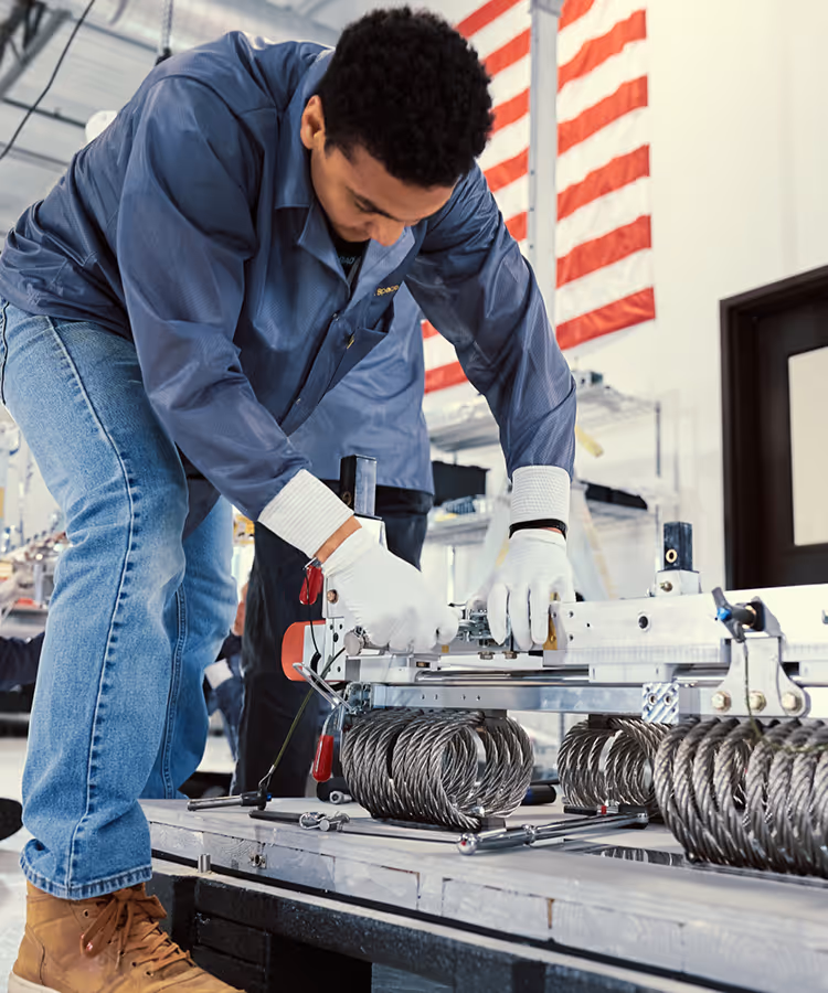 Capella Team Member working on Acadia satellite in Colorado manufacturing facility
