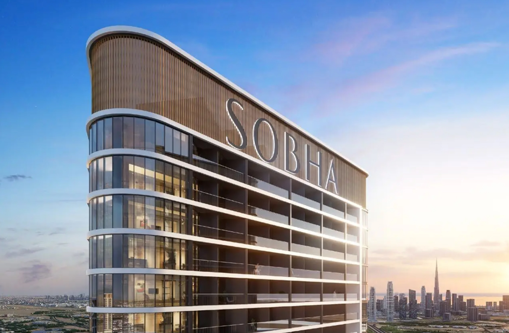 Modern high-rise building with large glass windows and balconies, displaying the name SOBHA, city skyline with tall skyscrapers in the background during sunset.