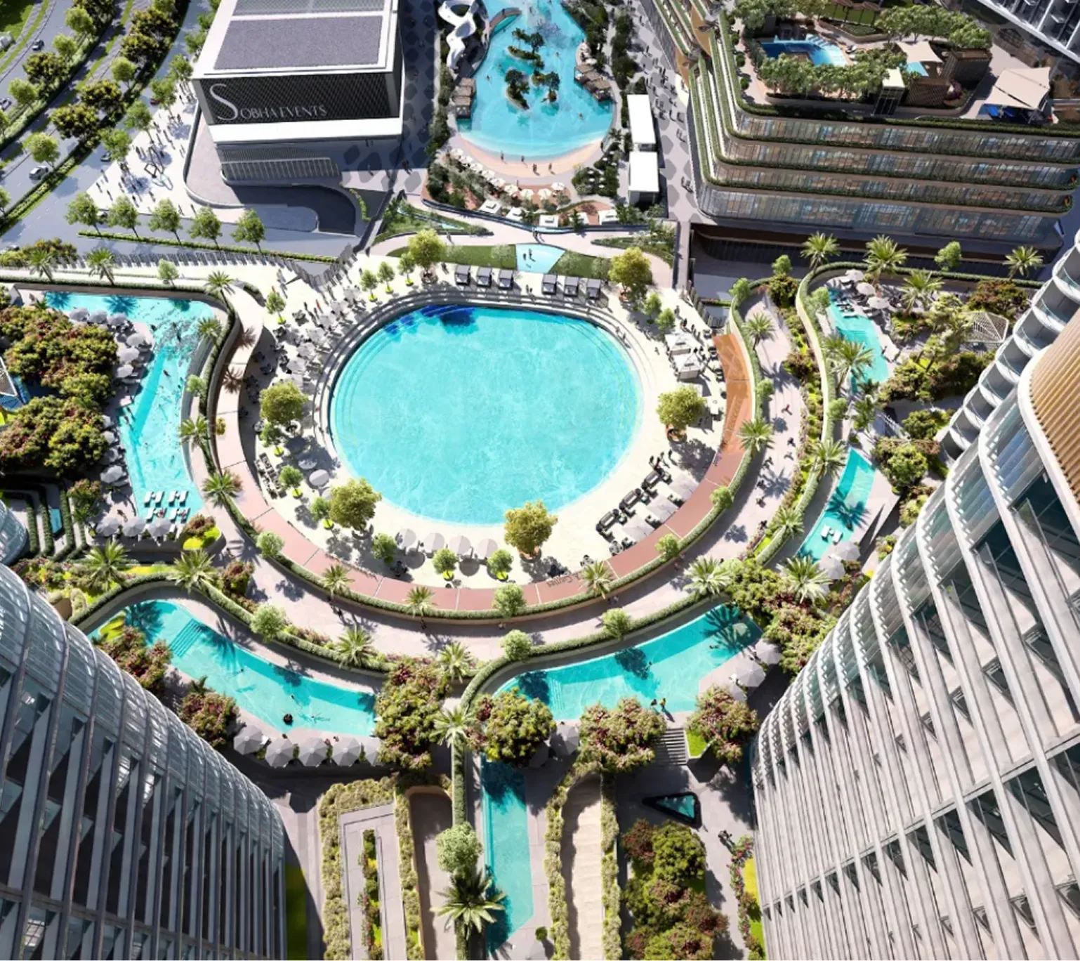 Aerial view of a modern urban complex featuring multiple swimming pools, palm trees, and high-rise buildings surrounding a large circular pool.