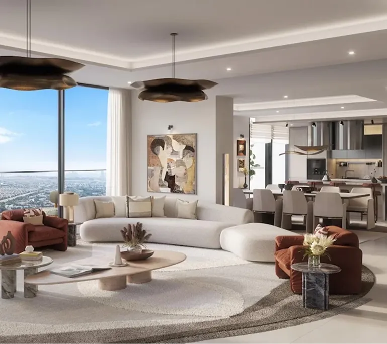 Modern living room with large curved white sofa, two rust-colored armchairs, round coffee tables, abstract wall art, and floor-to-ceiling windows overlooking a cityscape.