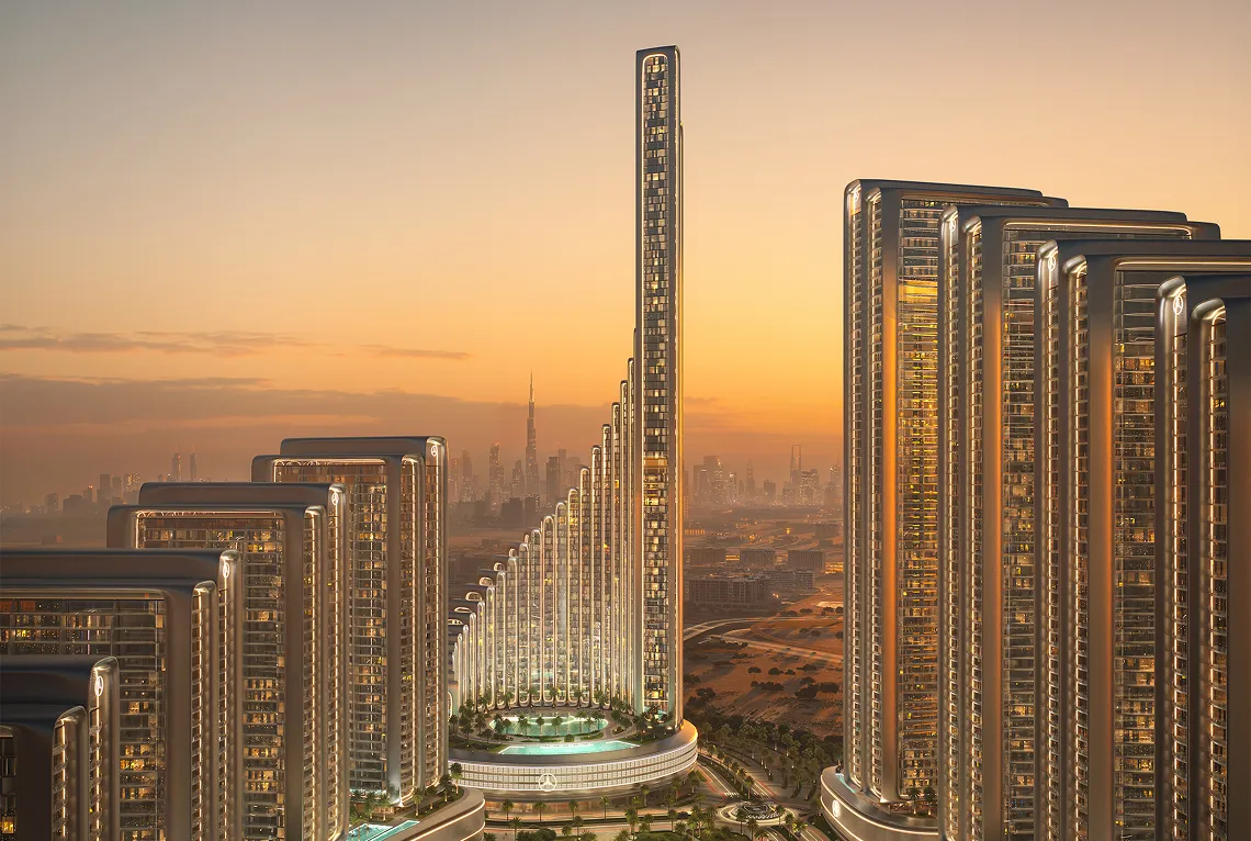 Modern high-rise buildings with illuminated edges surrounding a taller central tower at sunset, with a city skyline in the background.