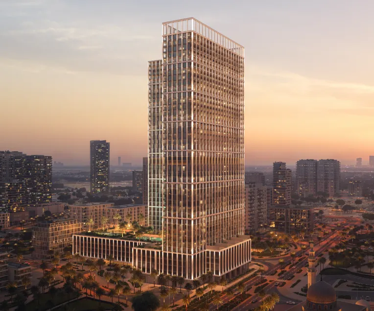 Modern high-rise building with illuminated grid facade against a sunset sky in a cityscape with palm trees and surrounding buildings.