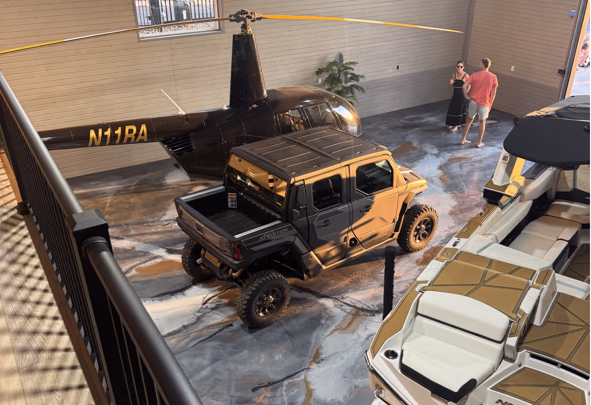 Interior of luxury garage condos with helicopter and boat