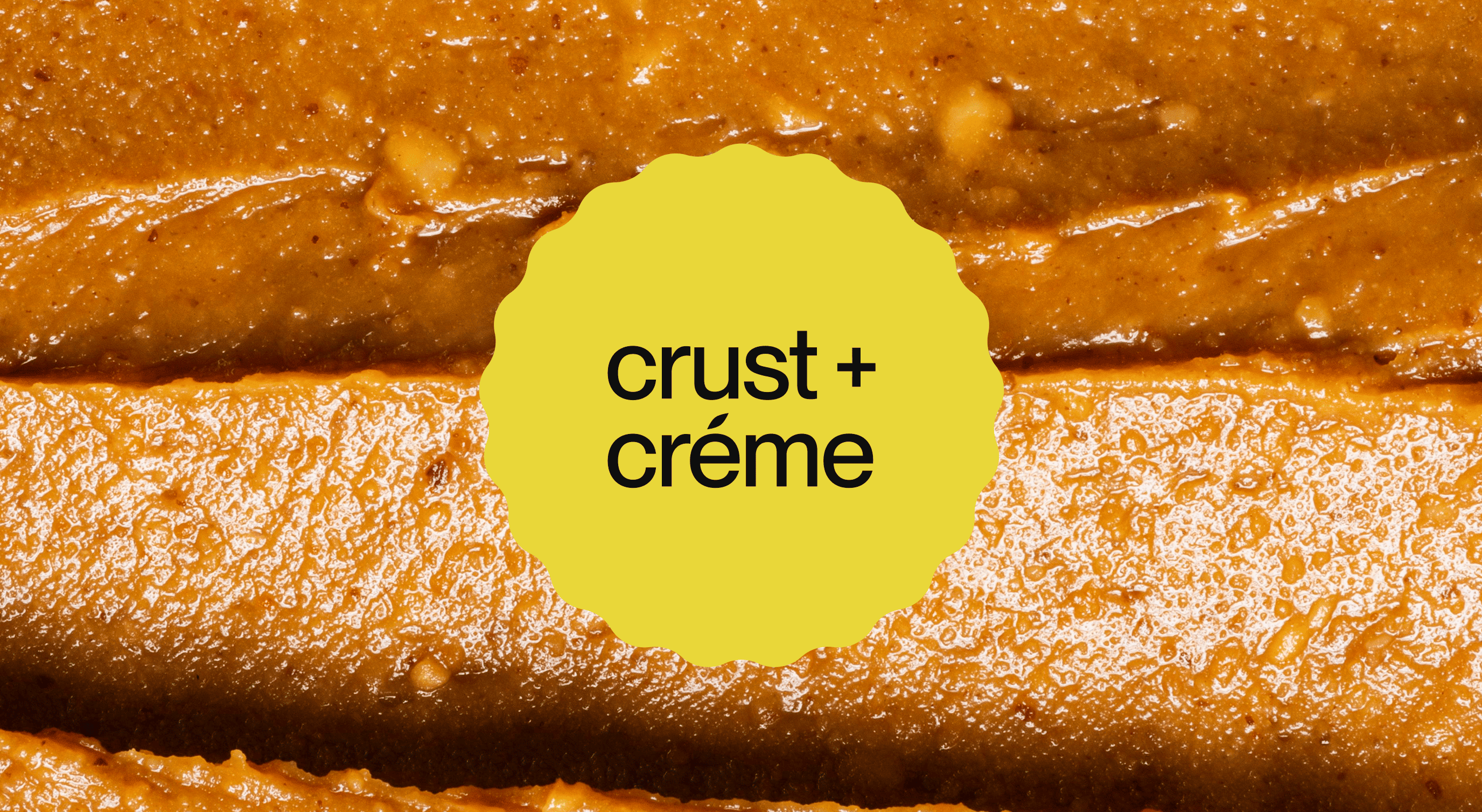 Close-up texture of a brown pie crust and smooth creamy filling with a yellow label reading 'crust + crème'.