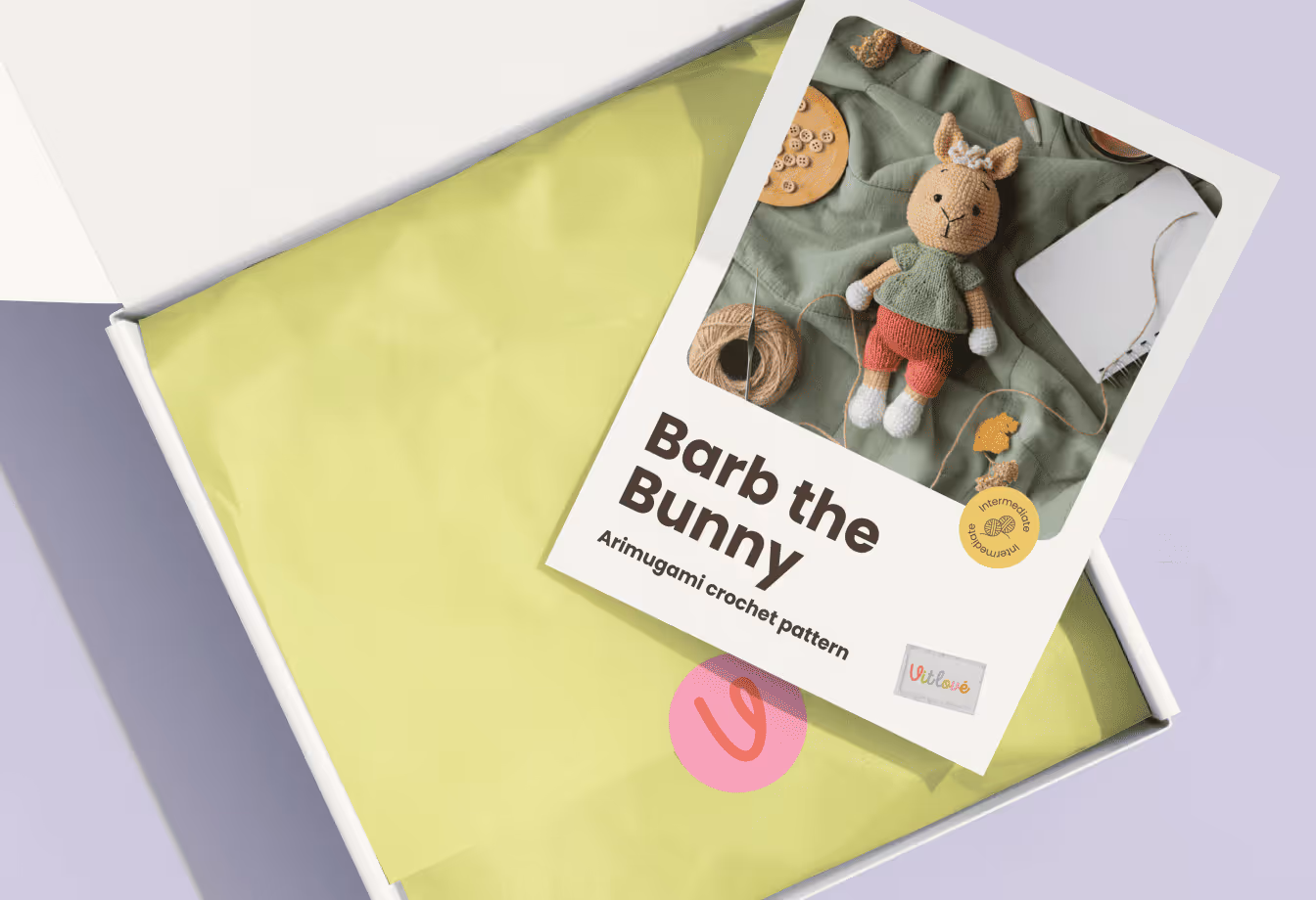 Poster on a concrete wall with text 'PAW CLUB' and 'EAT PLAY LOVE' accompanied by icons of a dog food bowl, a bone, and a heart, with a blurred dog in the foreground.