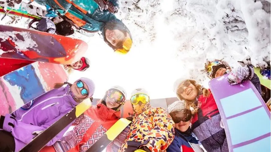 Boarding students enjoying outdoor sports during a winter excursion
