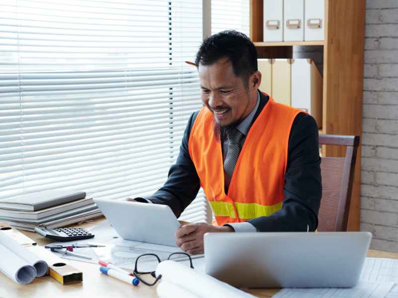 Property manager reviewing vendor documentation before approving work