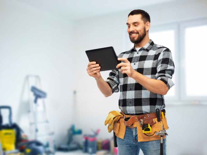 Trade technician completing a dispatched work order at an apartment community
