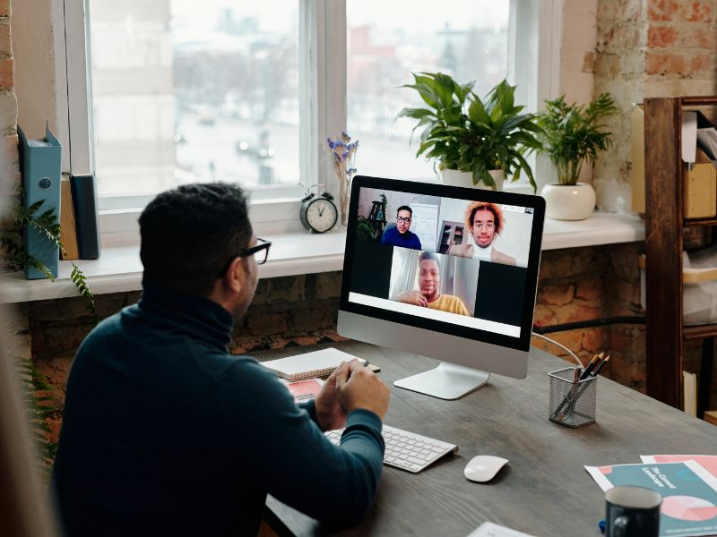 Customer relationship manager walking clients through a portfolio review