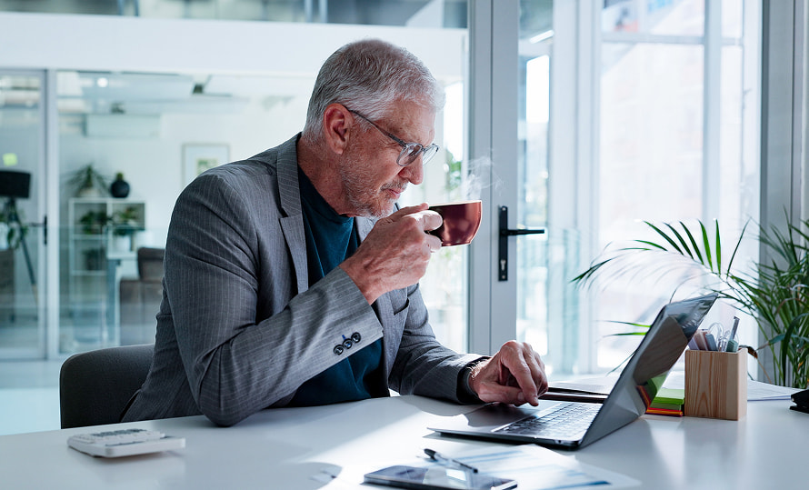 Retiree reading through financial education articles