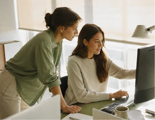 Two people pair-working at a desk