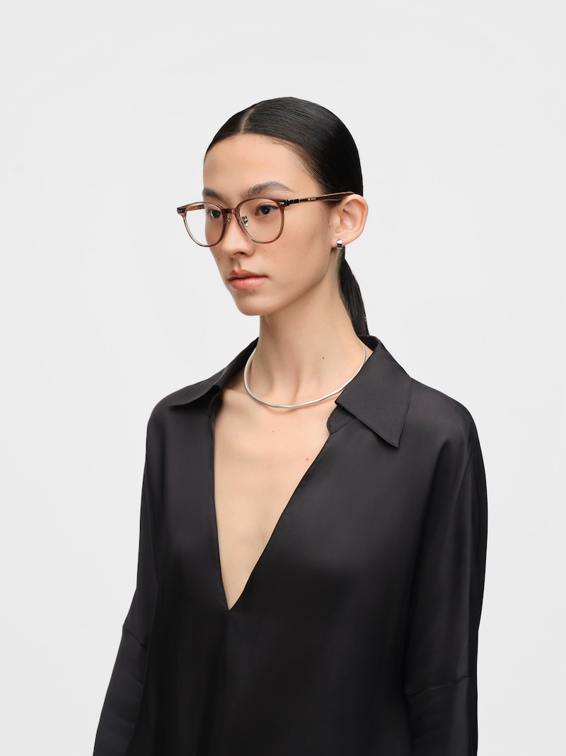 [background image] a happy customer getting new glasses (for a optician store and optometry clinic)