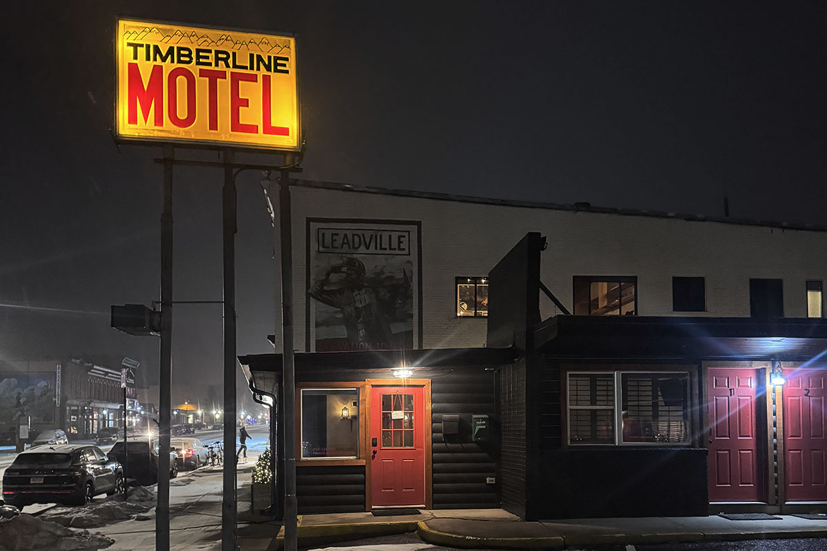 The Timberline motel exterior at night with warm lighting