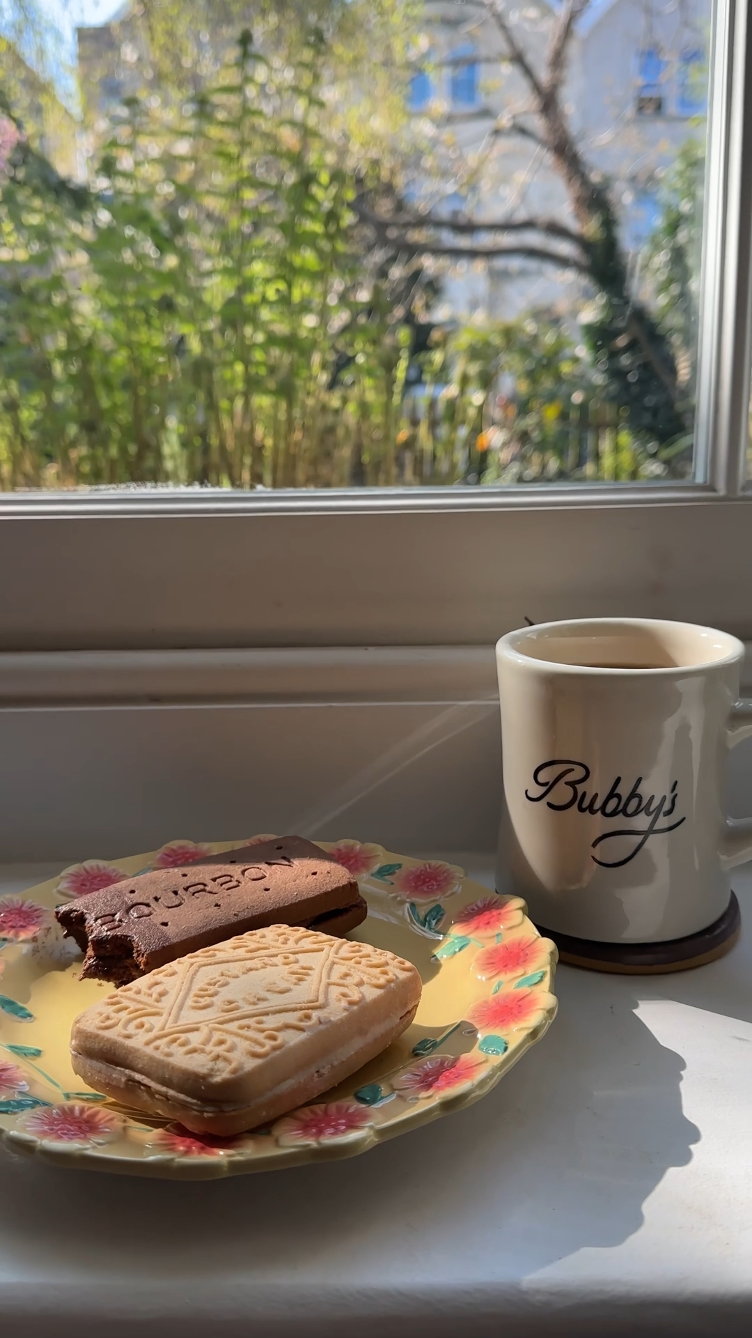 giant bourbon and custard cream biscuit sandwiches filled with buttercream and served with tea