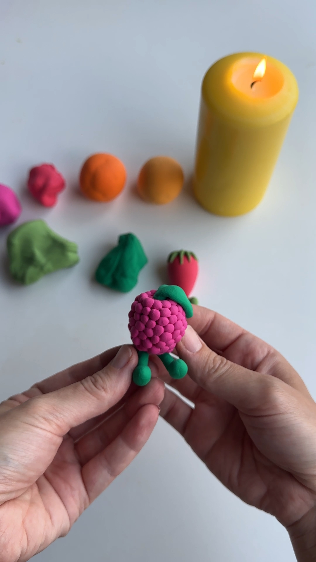 raspberry clay magnet covered in small textured clay bumps