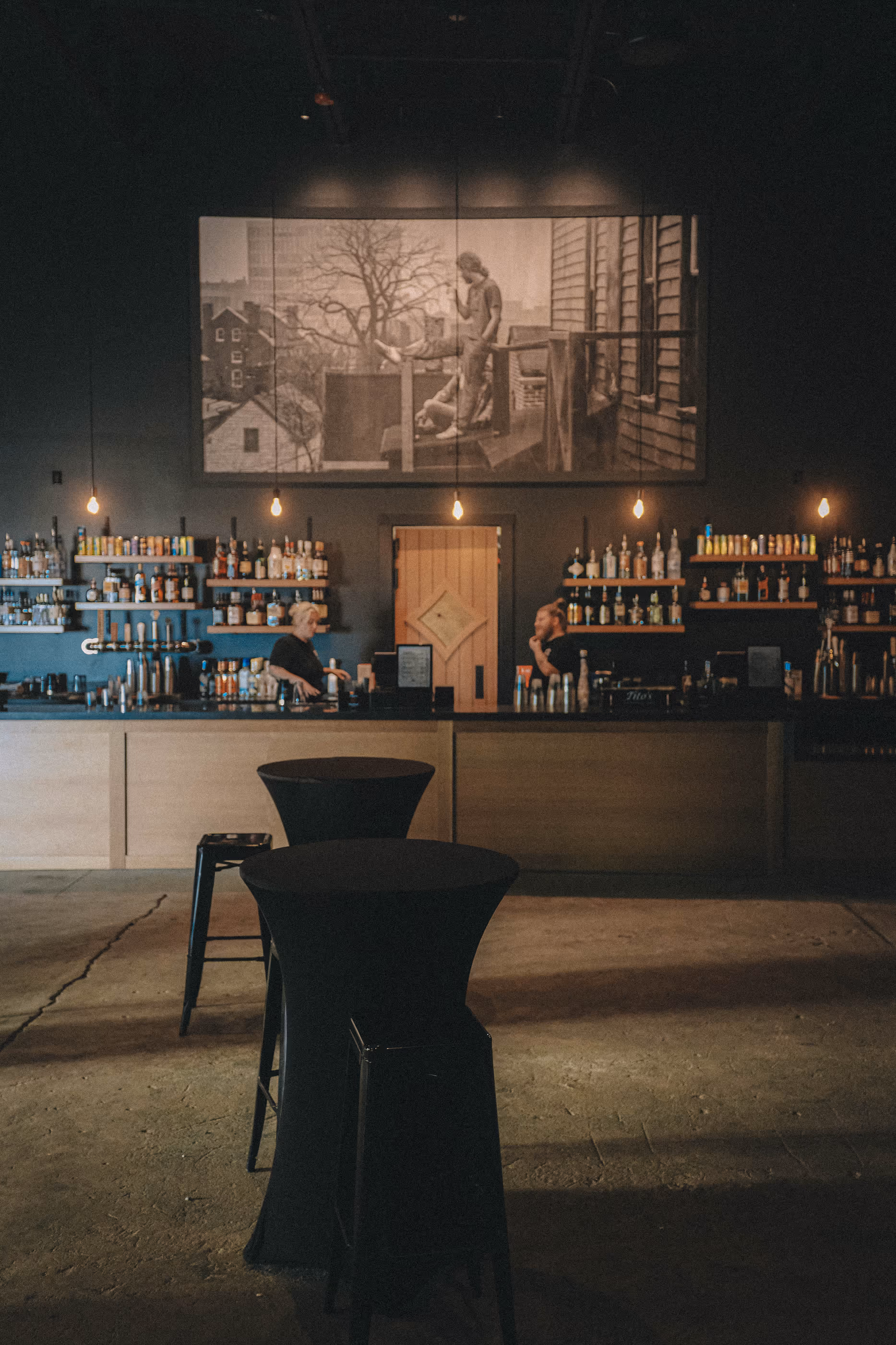 Lounge with cocktail tables and full bar at Live at Madrid's