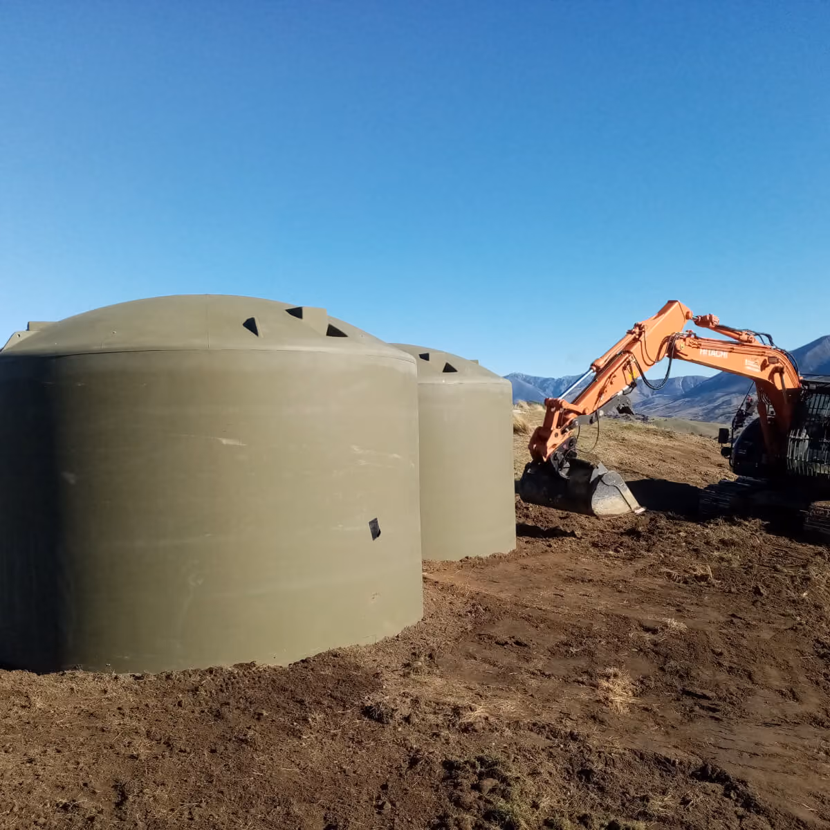 Two large water tanks being installed