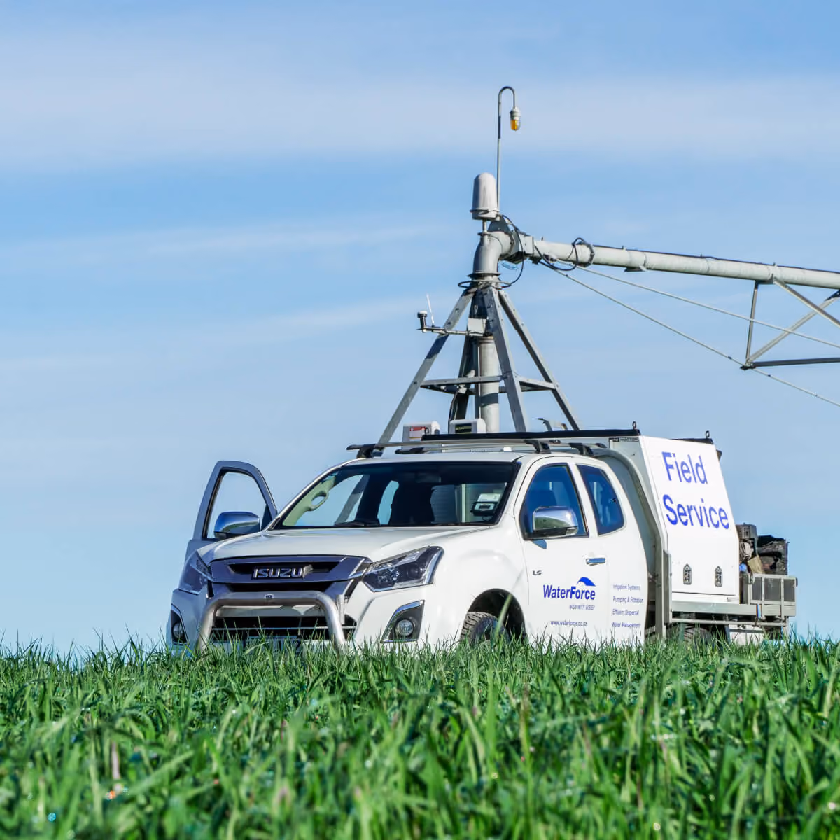WaterForce field-service vehicle beside a pivot irrigator