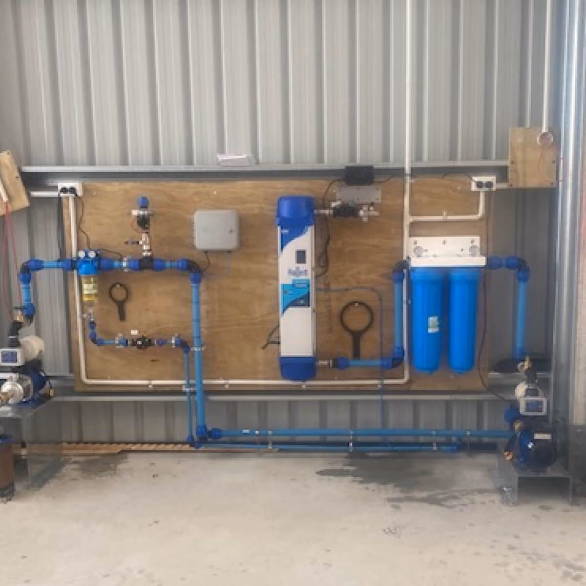Water filtration equipment and pipework mounted inside a shed