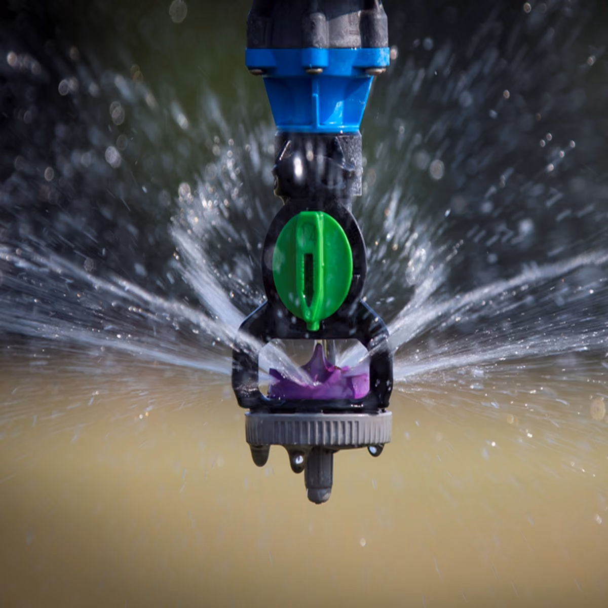 Rotary sprinkler head operating over water