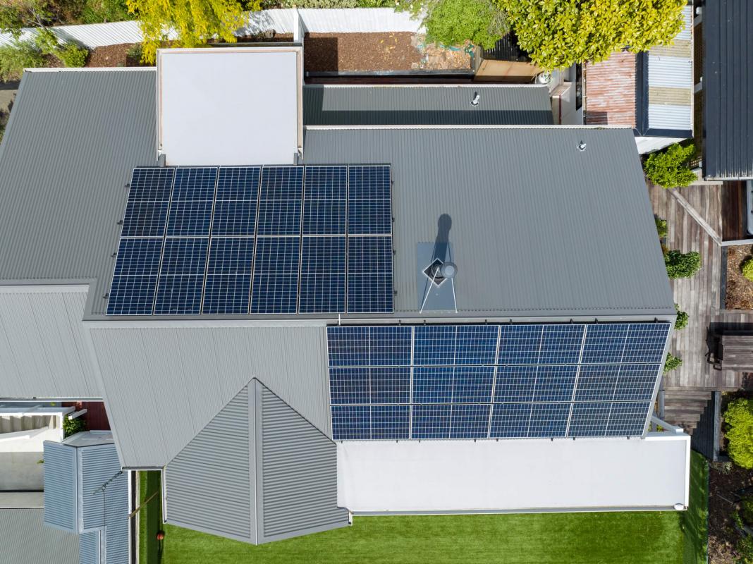 Close-up aerial view of solar panels installed on the roof of the Cashmere Hills character home