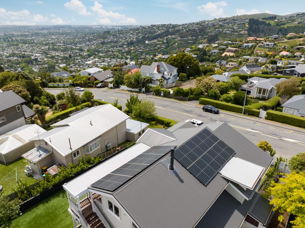 Aerial view of the Cashmere Hills character home showing the roof, solar panels, landscaped grounds and surrounding hillside neighbourhood