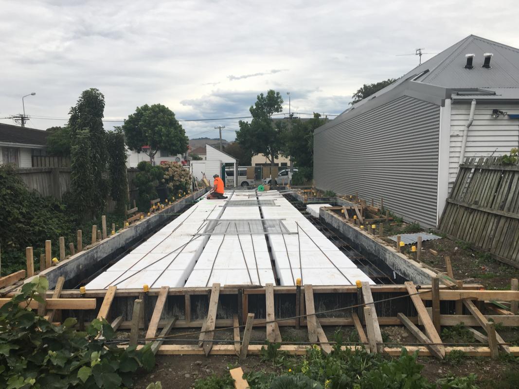 Aerial view of the Worcester Street property showing the narrow site, mono-pitch roof and surrounding Christchurch CBD neighbourhood