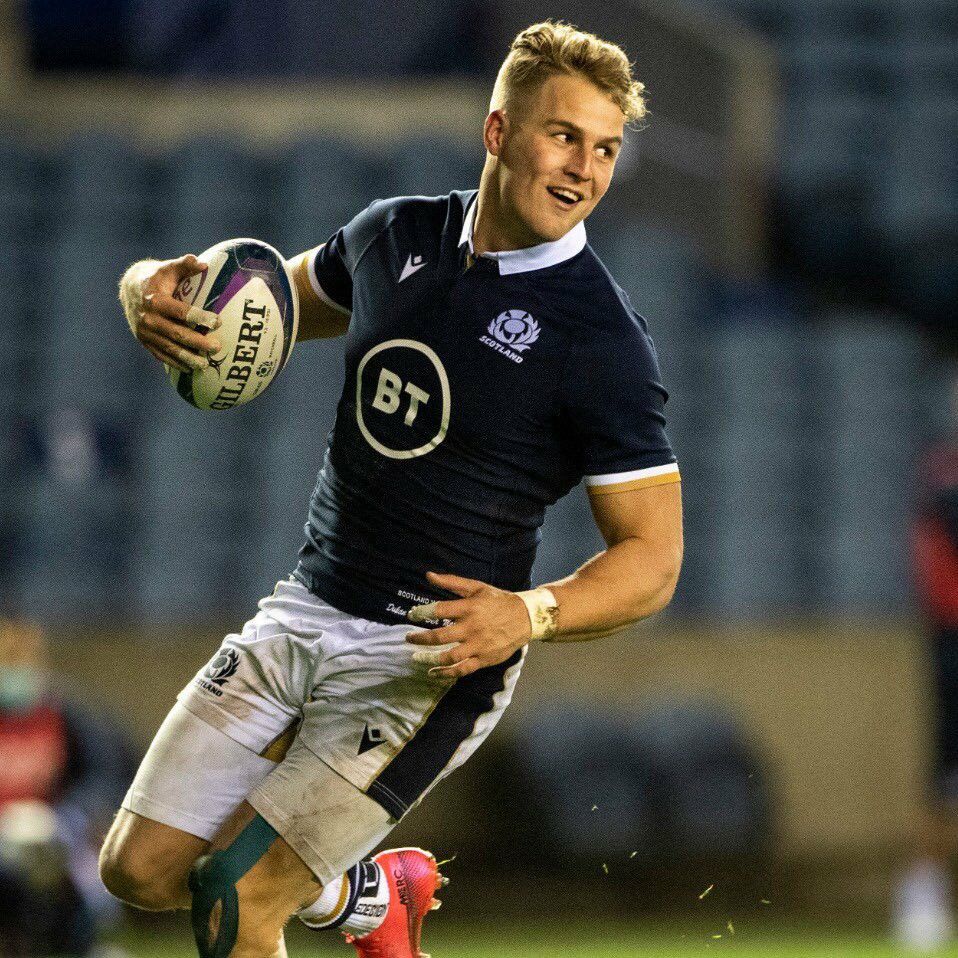 Scotland rugby player carrying the ball during a match