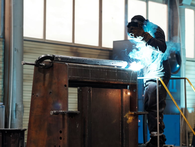 Welder fabricating a large steel component for a nuclear industry application