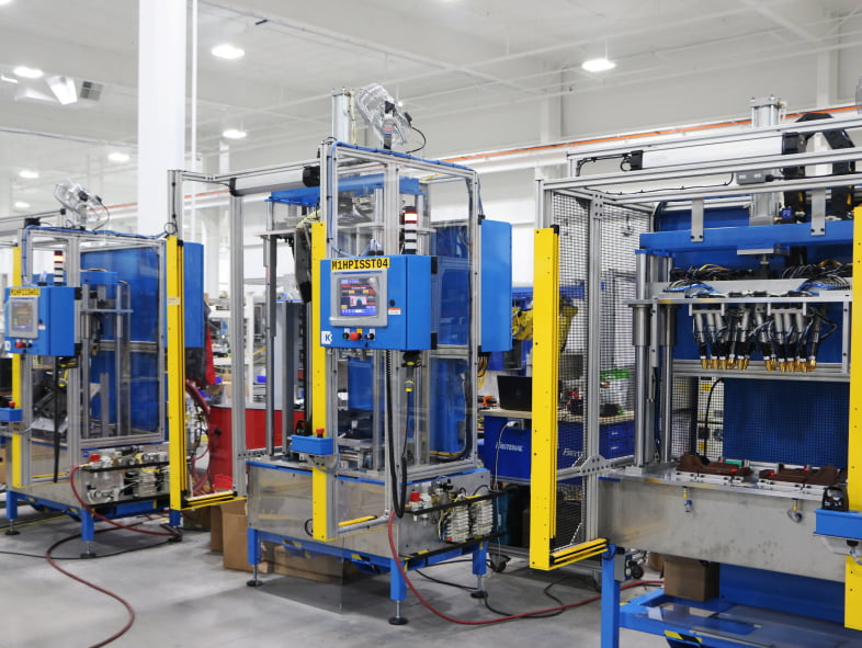 Custom automated machine-building system assembled on a manufacturing floor