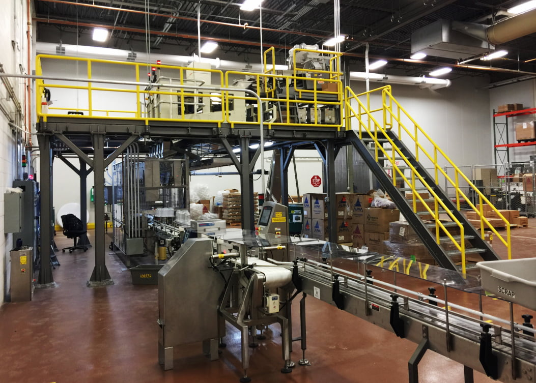 Custom automated manufacturing and material handling system installed in a production facility