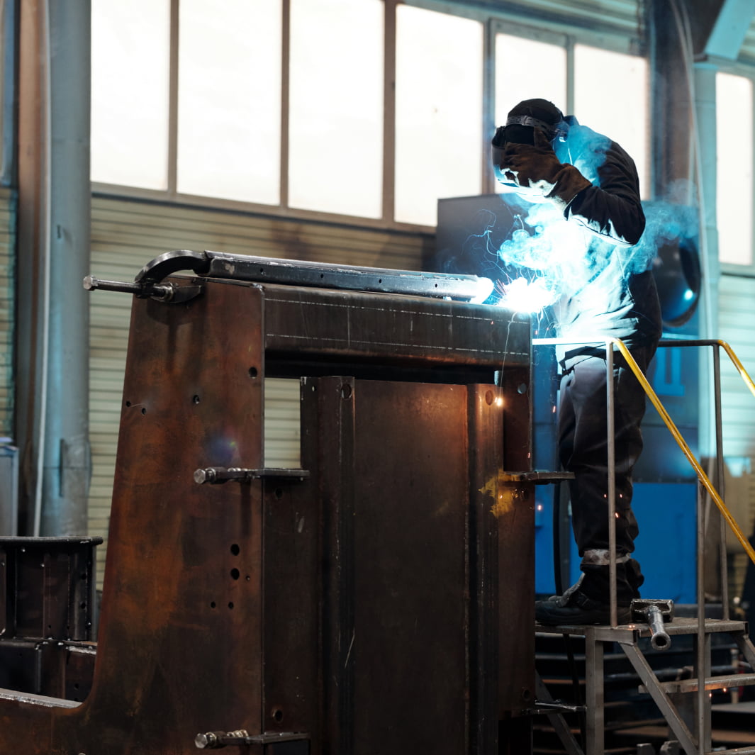 Certified welder fabricating a large steel assembly for nuclear industry applications