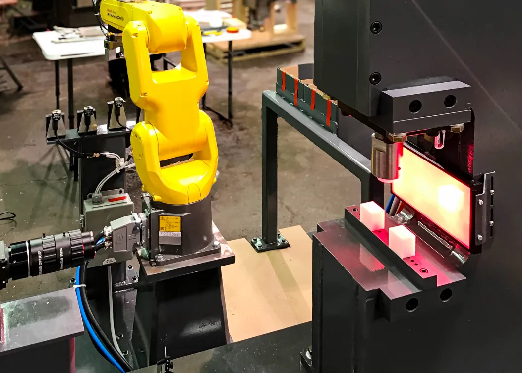 Automated robotic inspection system for pharmaceutical and medical device manufacturing