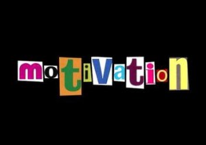 motivation spelt in cut out letters - a key factor in setting professional goals
