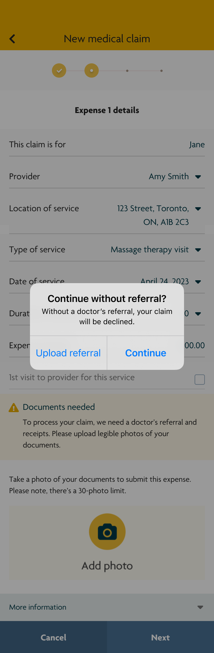Version 1 of a high-fidelity wireframe of a user filling out their health benefits claim. There is a native popup alert warning users that their claim will be declined if they continue without a referral. 