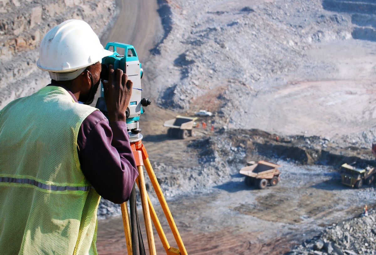 Mine worker surveying a mine site