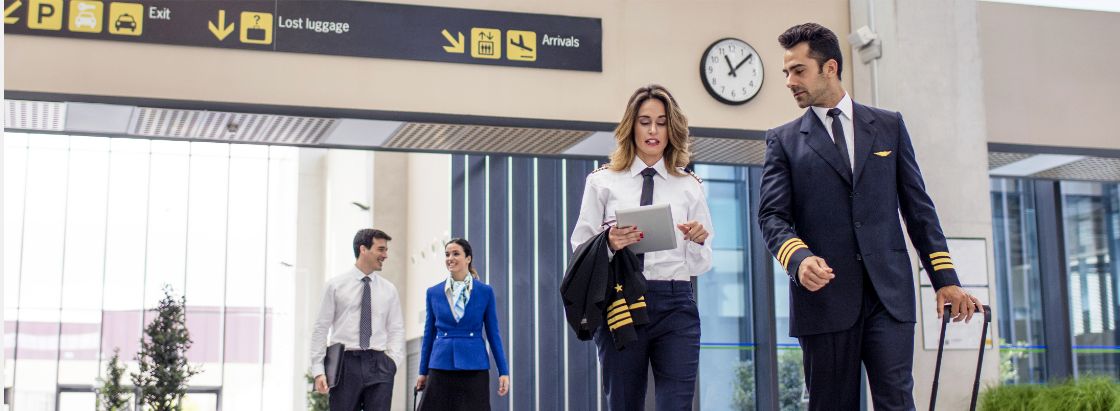 Airline employees walking through an airport