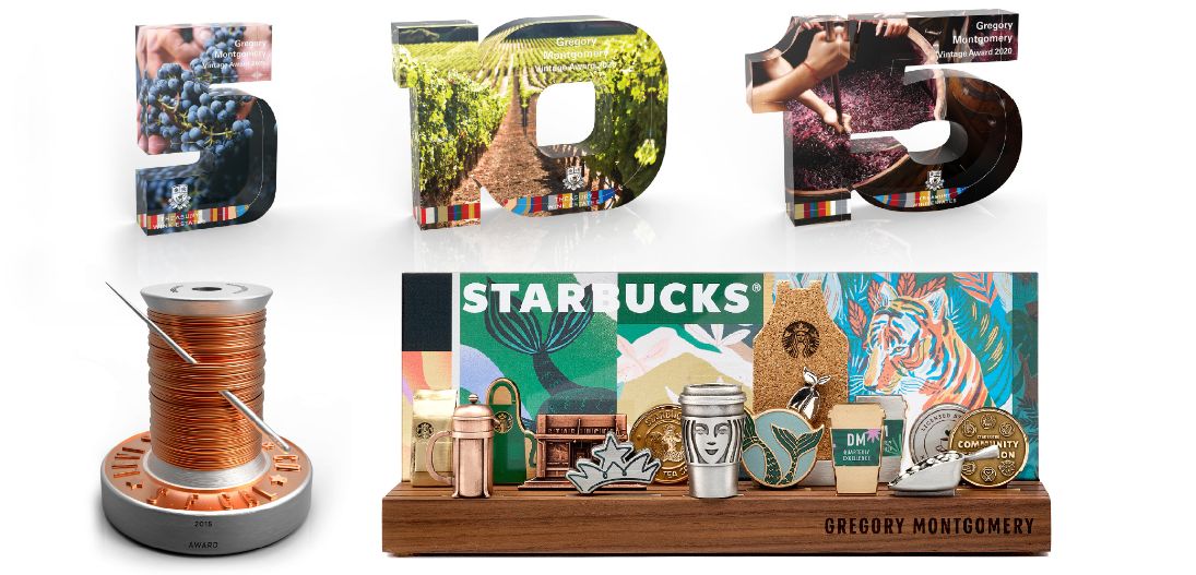 Custom awards designed and manufactured by O.C. Tanner, including numerals, a custom trophy, and Careerscapes.