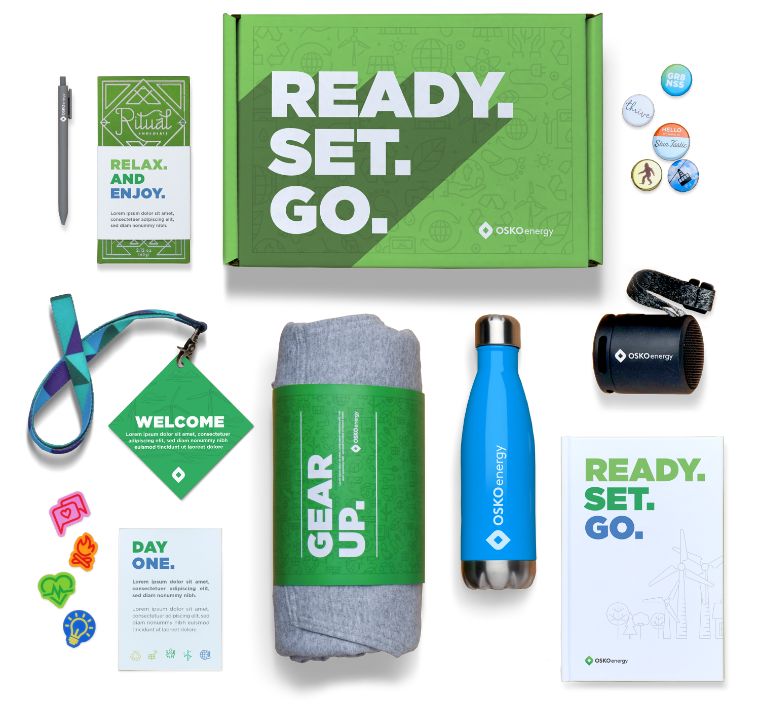 Onboarding swag boxes with custom branded merchandise and welcome gifts, sourced and fulfilled by O.C. Tanner