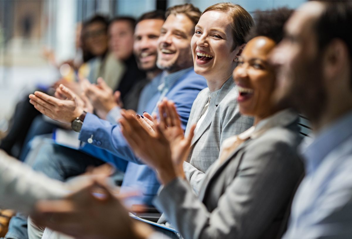 Employees celebrating together in an office.